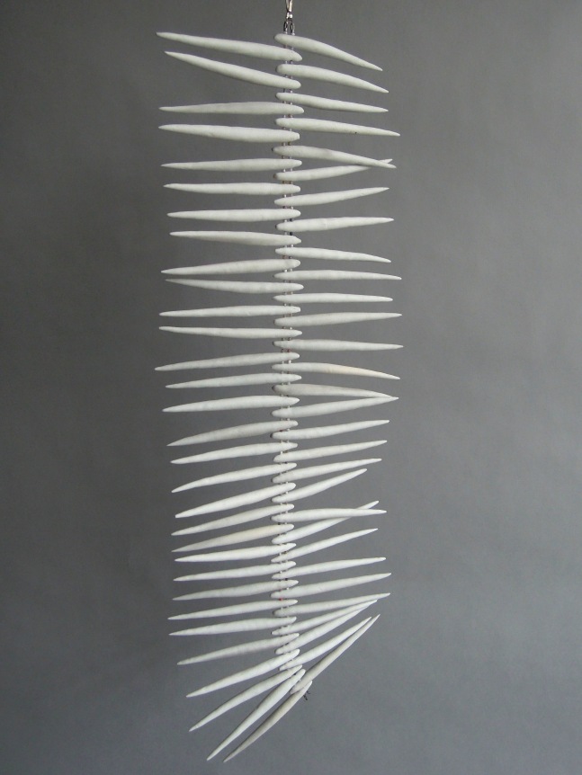 Chris Garofalo.&nbsp;gulugod o tribo,&nbsp;2020. Unglazed porcelain, glass beads, 26 x 9 x 3/8 inches.&nbsp;