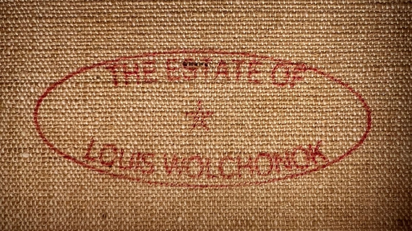 Image of the estate stamp on verso of Louis Wolchonok's painting &quot;Beach Scene&quot;.