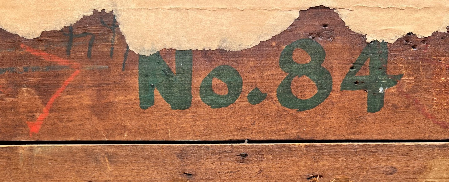 Closeup image showing number 84 on verso of William C. Palmer's painting &quot;Fish Story&quot;.