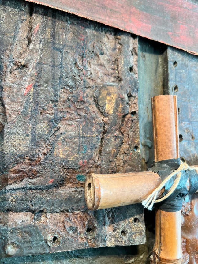 Image of mixed media 1973 artwork entitled Closeup image detail of &quot;Yangtze&quot; 1973 by artist Stephen Buckley made of brown oil paint, nails, iron fillings, string, bamboo, canvas and other materials.