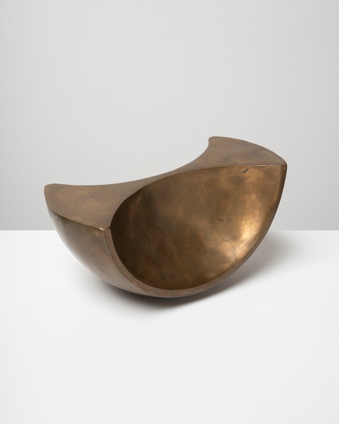 This is an image of a bronze sculpture made by Ruth Vollmer in 1968 titled: Figure of Half Revolution.