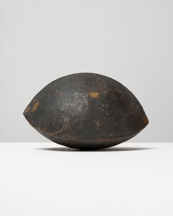 This is an image of a bronze sculpture made by Ruth Vollmer in 1966-67 titled: Trigonal Volume.