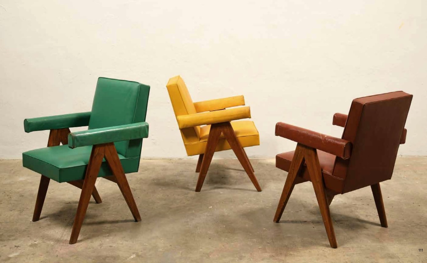 Three of Le Corbusier & Pierre Jeanneret's "Committee" armchair in green, yellow and red (left to right)