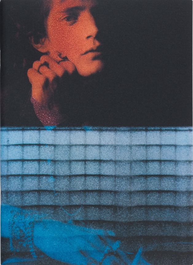 Early collaged piece with spray paint, self-portrait above, and his hand below.