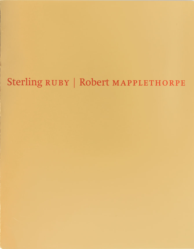 Red Text on reflective  gold mirrored surface