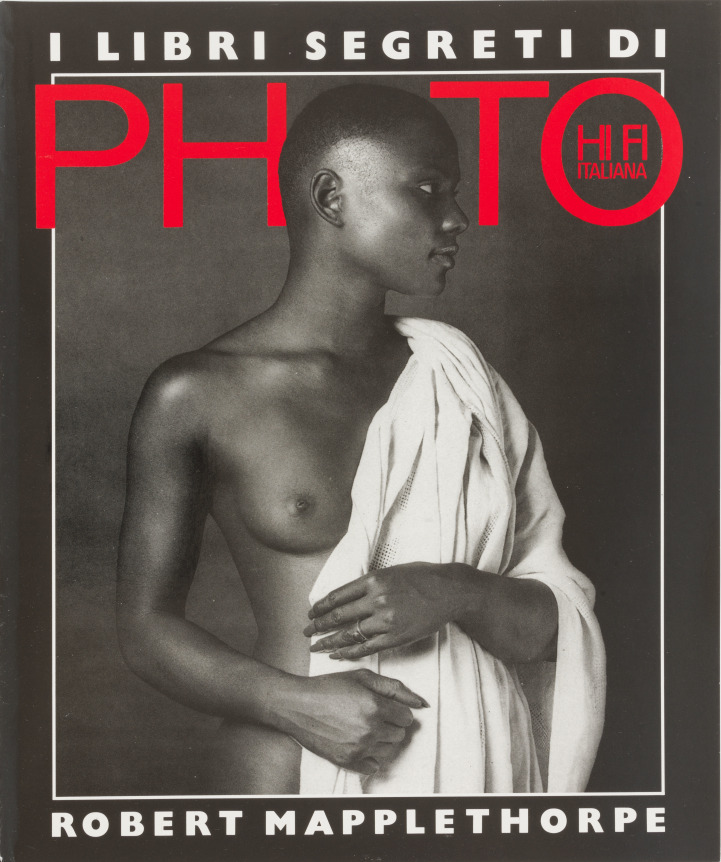 Portrait of Ada, naked, turning away from camera with a robe draped over one shoulder.  Red and white text.