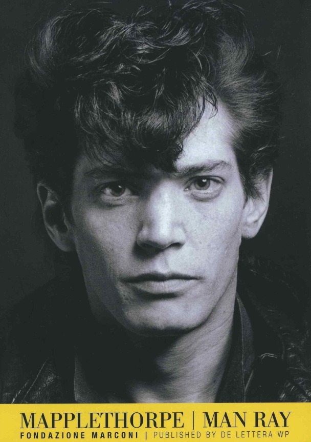 Selt-Portrait of Robert Mapplethorpe, with yellow band at the bottom of the page, and black text.