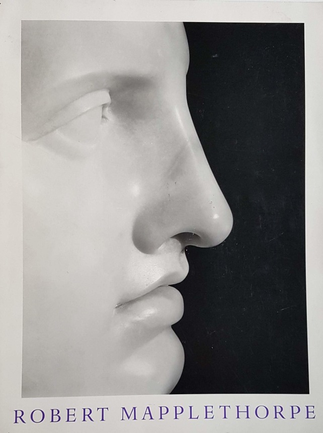 Profile portrait of a marble bust of Apollo