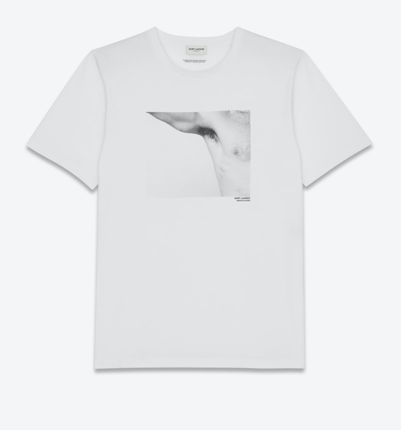 White t-shirt with a photograph of a man's extended arm showing his armpit and a portion of his chest.