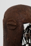 Kader Attia
Mirror Mask&amp;nbsp;(detail)
2020
Wooden mask, mirror fragments, black pigment
Artwork Dimensions:
11 3/4 x 6 5/8 x 5 1/2 inches (30 x 17 x 14 cm)
Overall Dimensions:
70 x 10 x 10 inches (177.8 x 25.4 x 25.4 cm)