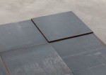 Carl Andre
North-East Deck, Glarus, Switzerland 1993
hot-rolled steel
10 units: 9-unit square (3 x 3) on floor with tenth unit superimposed on north-east unit
each: 1/4 x 19 3/4 x 19 3/4 in. (.6 x 50.2 x 50.2 cm)
overall: 1/4 x 59 x 59 in. (.6 x 149.9 x 149.9 cm)
