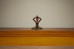 Miracles on the wind | 2025
Bronze, turmeric & wood
6″ x 96″ x 48″ ; 13.5″ x 10.5″ x 8″ (Figure)
TG 5070