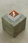 Siobh&amp;aacute;n Hapaska,&amp;nbsp;Footings, 2011, jesmonite, iron powder, white granulated marble, slate powder, perlite,vermiculite, olive oil and lit taper, 25 elements arranged in a specified grid, 19 x 15 x 15 cm each / 7.5 x 5.9 x 5.9 in each