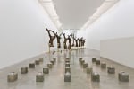 Siobh&amp;aacute;n Hapaska,&amp;nbsp;Footings, 2011, jesmonite, iron powder, white granulated marble, slate powder, perlite,vermiculite, olive oil and lit taper, 25 elements arranged in a specified grid, 19 x 15 x 15 cm each / 7.5 x 5.9 x 5.9 in each