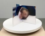 Lucas Blalock Film-Object (Artist's Head) 2020 Dye sublimation prints on aluminum, book cloth, motorized turntable display 35 x 59.5 x 59.5 cm / 13 3/4 x 23 3/8 x 23 3/8 in