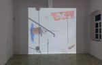 Installation view of projected film and projector by Alex Hubbard