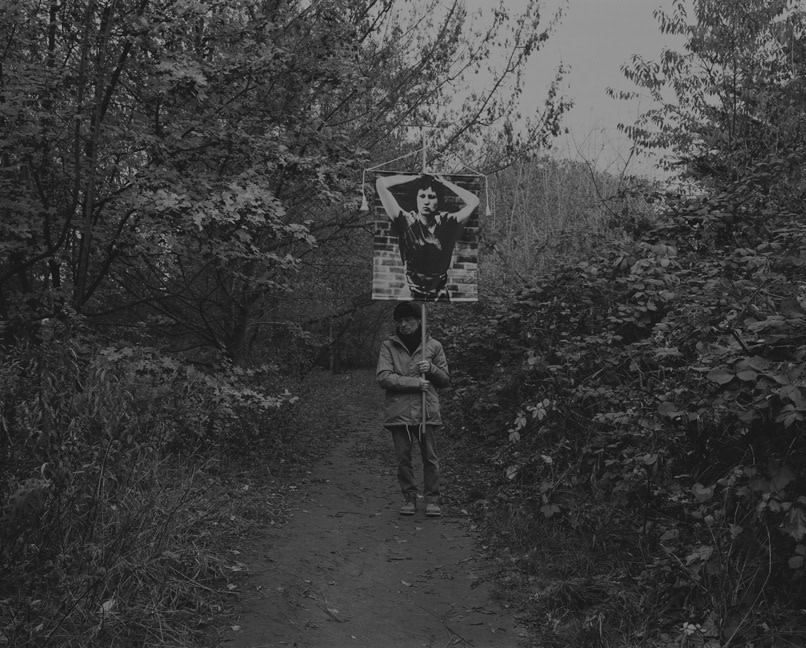 Daniel Joseph Martinez On the path that runs parallel to the highway close to Checkpoint Bravo, between the Königsweg Brücke (Kingsway bridge). A special interest in this area close to the bridge arose when, due to its location in the area of the wall, it became an observation point for East and West., 2017 Medium format black & white film printed digitally on Hahnemule Fine Art Baryta, Gloss 315gsm 60 x 72 in (152.4 x 182.88 cm)