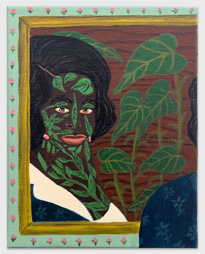 Reflected image of a woman in a mirror with vegetation tattoos and a floral border