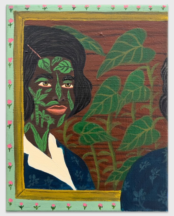 Reflected image of a woman in a mirror with vegetation tattoos and a floral border