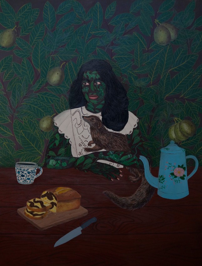 Sanbras holding a mongoose sitting at a table