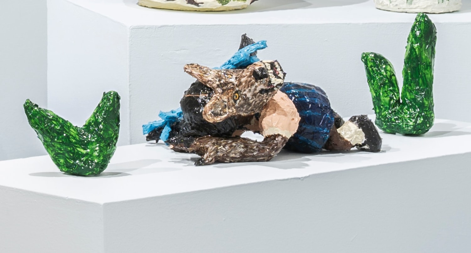 Sculpture of Sanbras with a beastly mask and claw