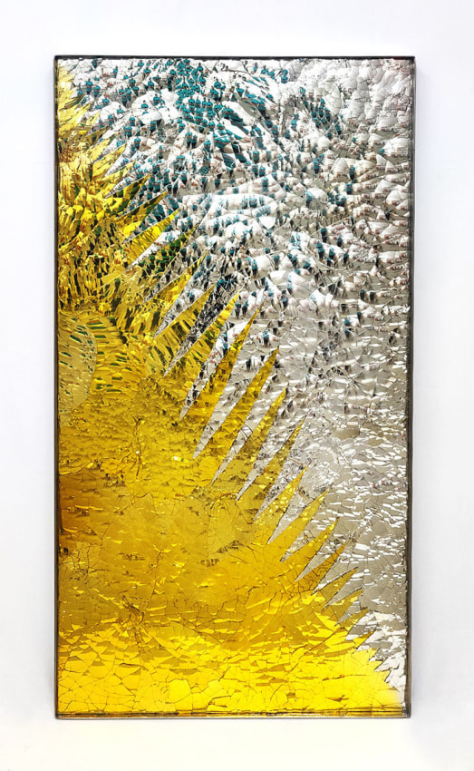 Reflective yellow and silver tone of colored mirrored glass diagonally divided split in the middle of the rectangular frame