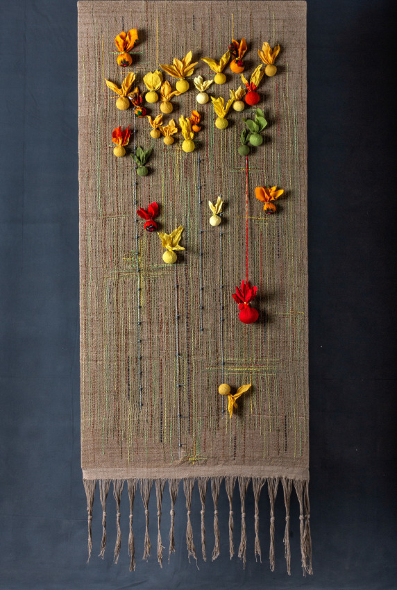 Shehnaz Ismail,&nbsp;What have they done to my land?,&nbsp;2018,&nbsp;Natural dyes hand woven fabric embroidered with natural dyed yarn, lentils and Tulsi seeds. steel barbed wire,&nbsp;63 x 29 in