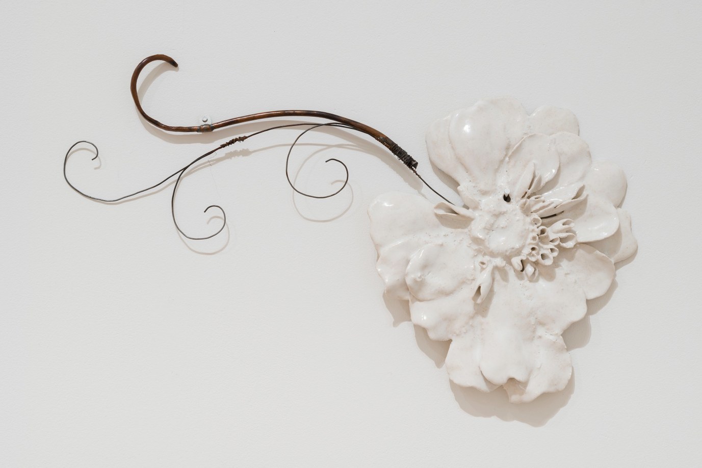 Mary Carlson, Small White Flower, 2023, glazed ceramic, copper, and wire, courtesy of Kerry Schuss Gallery
