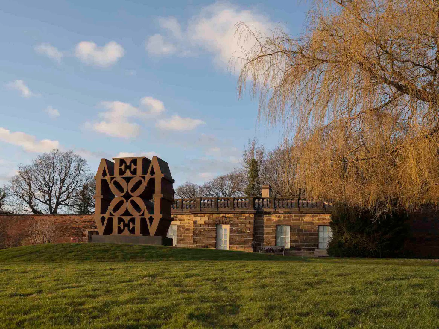 Robert Indiana's monumental Cor-Ten LOVE Wall installed at the Yorkshire Sculpture Park for Robert Indiana: Sculpture 1958–2018