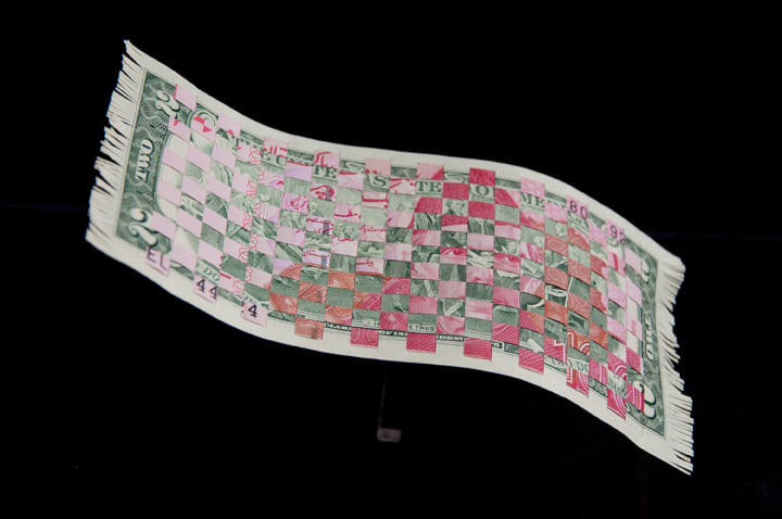Abdullah M. I. Syed Weaving Myth III (Flying Rug Series) 2016 Hand-cut and weaved U.S. $2 bill and 100 Pakistani Rupee with custom Perspex vitrine 6 x 10 x 6