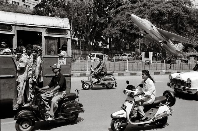 Raghu Rai Fighter Plane in City Traffic, Bangalore Edition of 10 2003 Digital scan of photographic negative on archival paper 18 x 27 in.