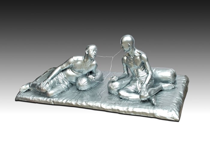 Debanjan Roy INDIA SHINING 7 (GANDHI SHARING IPOD) 2009 Fiberglass with acrylic paint Edition of 5 36 x 108 x 48 in.