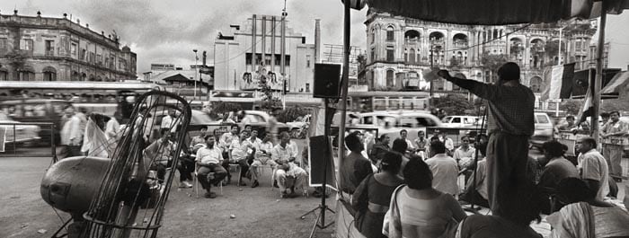 Raghu Rai ALL EYES AND EARS FOR THE LEADER AT CHOURANGHEE, KOLKATA 2006 Digital scan of photographic negative on archival paper 20 x 50 in.