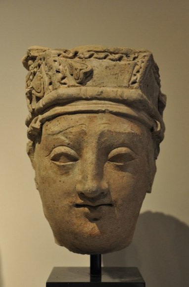 Head of a Devotee Ancient Region of Gandhara, Kushan Period 2nd/3rd Century Stucco with traces of pigment Height: 9 in. NFS