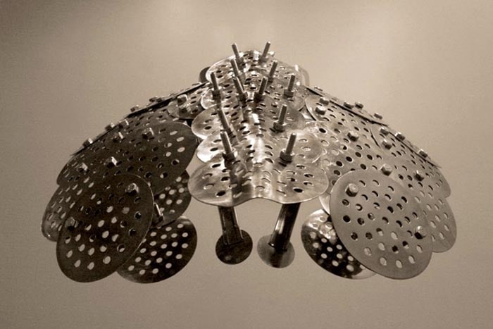 Adeela Suleman CASE 2 2008 Steel drain covers, steel tongs, nuts and bolts, steel measuring spoons, steel frying spoon 18 x 18 x 21 in.