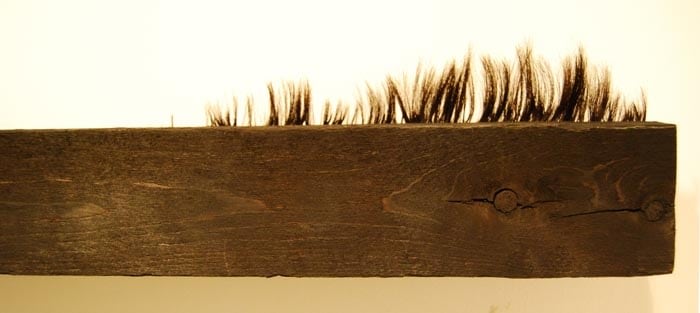 Saad Qureshi TOWARDS MEANING 2010 Burnt railway sleeper and human hair 4 x 47 x 6 in.