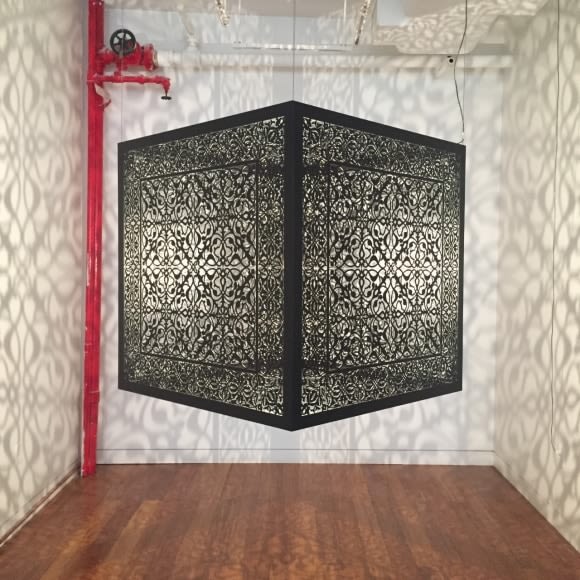 Anila Quayyum Agha Shimmering Mirage (Ed. Of 6) 2016 Laser-cut black steel and bulb 36 x 36 x 36 in.