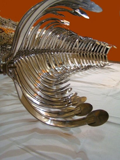 Adeela Suleman CONFLICTING SIDES 2009 Steel drain cover, steel tongs, nuts & bolts (two separate pieces but to be displayed as shown in image 1) Piece 1 (left) 81.5 x 14 x 22 (depth) in.; Piece 2 (right): 78 x 11 x 19 (depth) in.