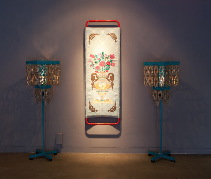 Adeela Suleman Praying in Her Richly Decorated Room III, 2012 Embroidery on cloth, iron, with powdererd paint and custom lamps Stretcher: 73 x 23.5 x 5 in. Lamps: 51 x 16 x 16 in.