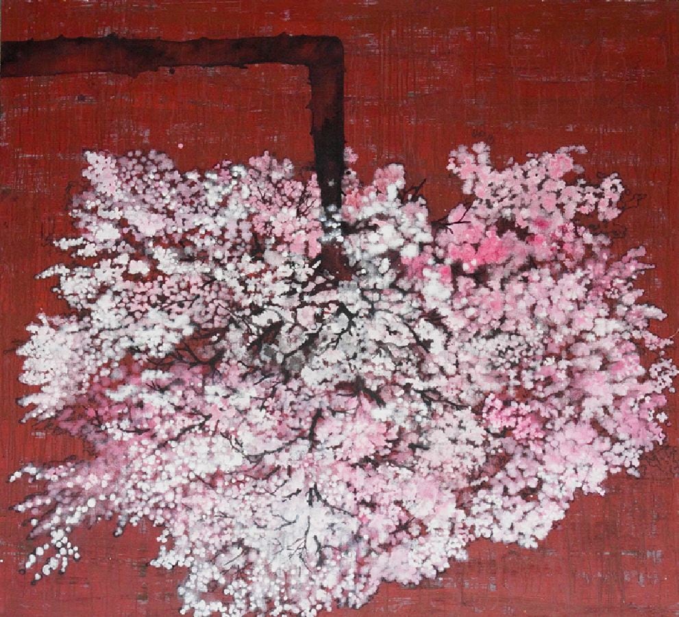 An upside-down cherry blossom on a vibrant red background.