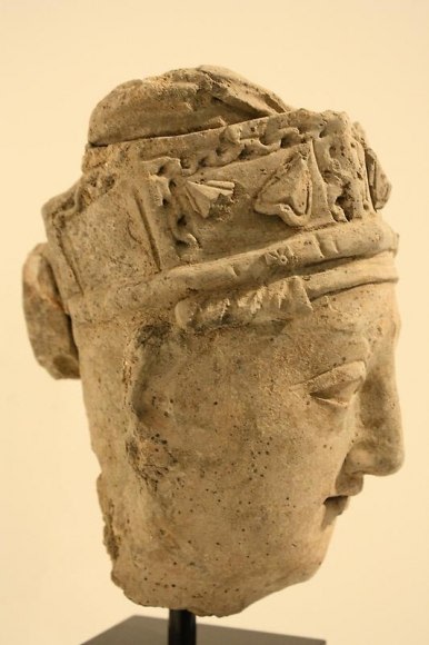 Head of a Devotee Ancient Region of Gandhara, Kushan Period 2nd/3rd Century Stucco with traces of pigment Height: 9 in. NFS