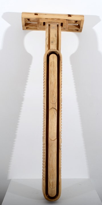 Debanjan Roy, Untitled (Shampoo Bottle), 2013, carved wood, 21 x 7 x 6 in
