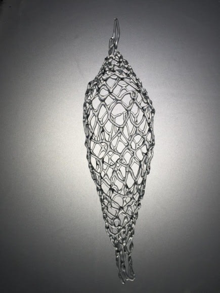 Glass sculpture with a very intricate checkerboard structure.
