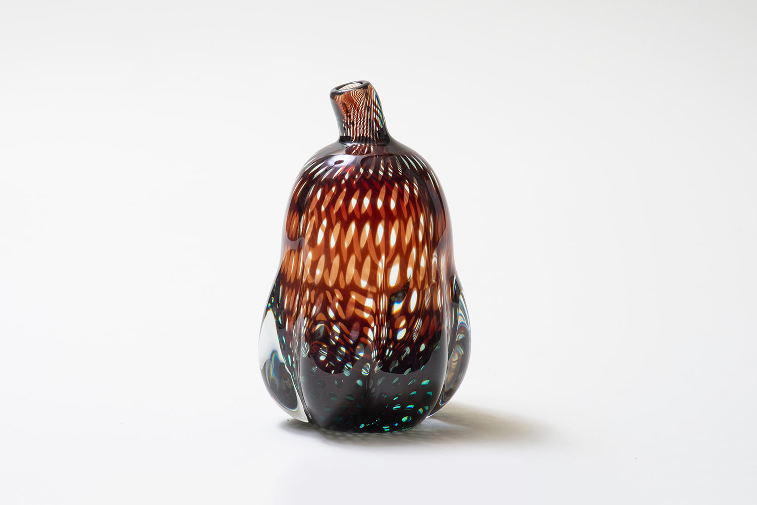 a cased glass vase in the &quot;graal&quot; technique by edward hald for orrefors, the gourd-shaped vase a piece of art glass sculpture, the thick clear glass encasing an optical pattern of burgundy lattice-like design