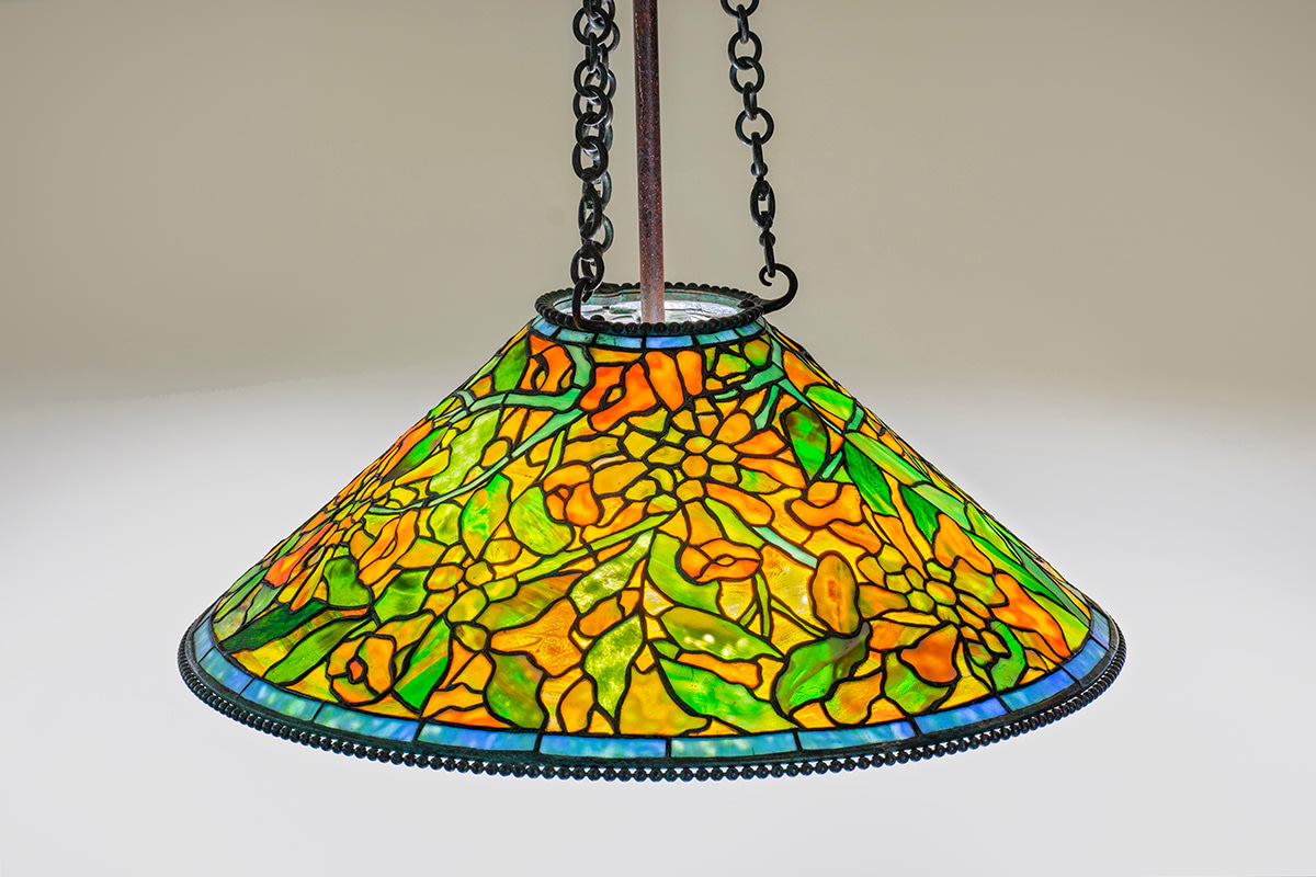 a hanging leaded glass original tiffany lamp dating from 1906, designed by Clara Driscoll and the &quot;Tiffany Girls,&quot; depicting the trumpet creeper vine with vibrant orange blossoms and green leaves