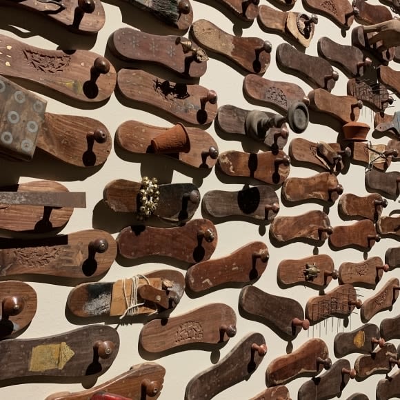 G. R. Iranna  Naavu (We Together)  2012  Wood and mixed media  Dimensions variable, site specific  500-650 padukas