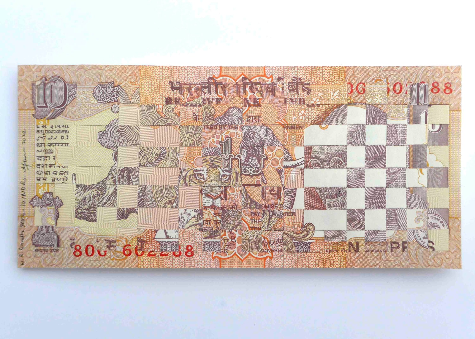 Abdullah M. I. Syed Weaving Myths and Realities: 10 Indian Rupees (Gandhi and State Animals, Rector/Verso), 2022 Hand-cut and woven uncirculated 10 Indian Rupee and archival tape 2.87h x 5.79w in