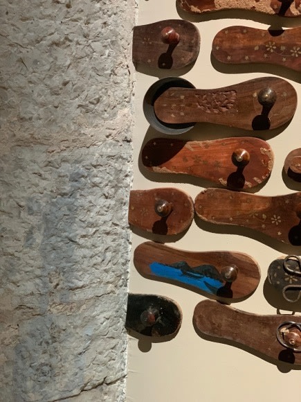 G. R. Iranna  Naavu (We Together)  2012  Wood and mixed media  Dimensions variable, site specific  500-650 padukas