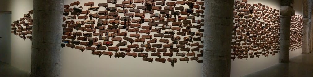 G. R. Iranna  Naavu (We Together)  2012  Wood and mixed media  Dimensions variable, site specific  500-650 padukas
