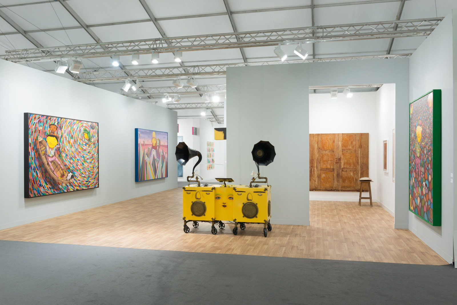 View of Lehmann Maupin's art fair booth at Frieze London 2018 featuring OSGEMEOS, perspective 3